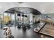 Modern gym featuring treadmills, stationary bikes, and large windows with a city view at 3324 Peachtree Ne Rd # 1813, Atlanta, GA 30305