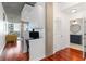 Hallway with built in desk and a view to the modern bathroom and open living area at 3324 Peachtree Ne Rd # 1813, Atlanta, GA 30305
