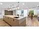 Bright kitchen island with modern appliances and a comfortable seating area with natural light at 3324 Peachtree Ne Rd # 1813, Atlanta, GA 30305
