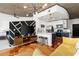 View of a modern and open living area that leads into a kitchen and has hardwood floors at 3324 Peachtree Ne Rd # 1813, Atlanta, GA 30305