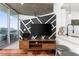 Modern living room with outdoor balcony, TV, and view of the kitchen area at 3324 Peachtree Ne Rd # 1813, Atlanta, GA 30305