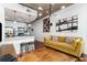 A contemporary living room that flows into the kitchen, decorated with artwork at 3324 Peachtree Ne Rd # 1813, Atlanta, GA 30305