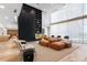 Bright lounge area with modern seating, a fireplace, and floor-to-ceiling windows at 3324 Peachtree Ne Rd # 1813, Atlanta, GA 30305