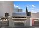 Outdoor grill with concrete base on a rooftop area perfect for barbecues and enjoying city views at 3324 Peachtree Ne Rd # 1813, Atlanta, GA 30305