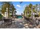 Outdoor seating area with tables and chairs provides a comfortable space to relax and enjoy the city views at 3324 Peachtree Ne Rd # 1813, Atlanta, GA 30305