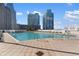 Rooftop pool with lounge chairs and tables offering residents a resort-style experience with city views at 3324 Peachtree Ne Rd # 1813, Atlanta, GA 30305