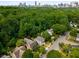 Aerial view of neighborhood homes and the city skyline at 851 Courtenay Ne Dr, Atlanta, GA 30306