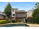 Lovely backyard view of a home's screened-in porch and in-ground pool at 851 Courtenay Ne Dr, Atlanta, GA 30306