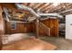 Unfinished basement with exposed beams and wood paneled walls at 851 Courtenay Ne Dr, Atlanta, GA 30306