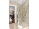Modern bathroom showcasing a glass-enclosed shower with beige tiles and modern fixtures at 851 Courtenay Ne Dr, Atlanta, GA 30306