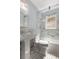 Bathroom showcasing a shower-tub combination, marble tiles, and vintage fixtures at 851 Courtenay Ne Dr, Atlanta, GA 30306