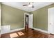 Bedroom with hardwood floors, olive walls, and natural light at 851 Courtenay Ne Dr, Atlanta, GA 30306