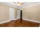 Empty bedroom with hardwood floors, neutral walls, and a ceiling fan at 851 Courtenay Ne Dr, Atlanta, GA 30306
