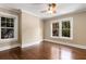 Light-filled bedroom featuring hardwood floors, crown moulding, and multiple windows at 851 Courtenay Ne Dr, Atlanta, GA 30306