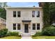 Charming two-story home featuring a brick facade, well-manicured lawn, and inviting front entrance at 851 Courtenay Ne Dr, Atlanta, GA 30306
