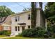 Stunning two-story home with a charming facade, well-maintained yard, and picturesque neighborhood setting at 851 Courtenay Ne Dr, Atlanta, GA 30306