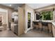 Cozy kitchen with breakfast bar, stainless steel appliances, and an exterior door with views of the deck and backyard at 851 Courtenay Ne Dr, Atlanta, GA 30306