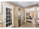 Modern kitchen with stainless steel appliances and an open doorway leading to a living room with great natural light at 851 Courtenay Ne Dr, Atlanta, GA 30306