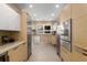 Contemporary kitchen featuring sleek wood cabinets, stainless steel appliances and a tile backsplash at 851 Courtenay Ne Dr, Atlanta, GA 30306