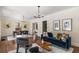 Sophisticated living room featuring hardwood floors, chic furniture, and elegant decor at 851 Courtenay Ne Dr, Atlanta, GA 30306