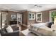Spacious bedroom with hardwood floors, multiple windows, and a gray accent chair at 851 Courtenay Ne Dr, Atlanta, GA 30306