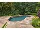 An in-ground pool surrounded by stone pavers and lush landscaping at 851 Courtenay Ne Dr, Atlanta, GA 30306