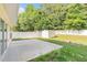 Backyard features a concrete patio, lawn, white fence, and storage shed at 1576 Thornwick Trce, Stockbridge, GA 30281