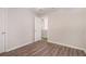 Bedroom featuring wood-look floors, neutral paint, and an open doorway at 1576 Thornwick Trce, Stockbridge, GA 30281