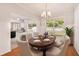 Elegant dining room featuring hardwood floors and modern lighting at 1576 Thornwick Trce, Stockbridge, GA 30281