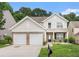 Charming two-story home with a two-car garage and well-maintained front yard at 1576 Thornwick Trce, Stockbridge, GA 30281
