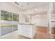 Kitchen island with granite countertop and access to the backyard sliding door at 1576 Thornwick Trce, Stockbridge, GA 30281