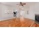 Living room with open access to kitchen with granite counters and stainless appliances at 1576 Thornwick Trce, Stockbridge, GA 30281