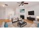 Bright living room with hardwood floors, fireplace, and modern furnishings at 1576 Thornwick Trce, Stockbridge, GA 30281