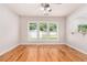 Bright living room with hardwood floors and views into the backyard at 1576 Thornwick Trce, Stockbridge, GA 30281