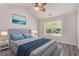 Bright main bedroom features a large window, ceiling fan, and neutral decor at 1576 Thornwick Trce, Stockbridge, GA 30281