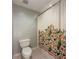 Cozy bathroom with a shower area enclosed by a decorative bird-patterned curtain and a modern toilet at 2700 Pine Tree Ne Rd # 1013, Atlanta, GA 30324