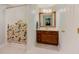 Bright bathroom featuring a bird-themed shower curtain and wooden vanity at 2700 Pine Tree Ne Rd # 1013, Atlanta, GA 30324