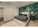 Stylish bedroom boasting a bold botanical wallpaper, plush carpet, and coordinated bedside decor at 2700 Pine Tree Ne Rd # 1013, Atlanta, GA 30324