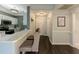 Inviting entryway with a kitchen view, hardwood floors, and white trim at 2700 Pine Tree Ne Rd # 1013, Atlanta, GA 30324