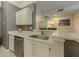 Modern kitchen featuring white cabinets, white marble countertops, and a stainless steel dishwasher at 2700 Pine Tree Ne Rd # 1013, Atlanta, GA 30324