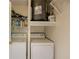 A compact laundry space equipped with a stacked washer-dryer unit at 2700 Pine Tree Ne Rd # 1013, Atlanta, GA 30324