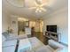Open-concept living room with kitchen view, gray sectional, and dark hardwood floors at 2700 Pine Tree Ne Rd # 1013, Atlanta, GA 30324
