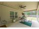 Covered back patio with seating and a ceiling fan overlooking a spacious backyard, offering an ideal outdoor retreat at 446 Vandenburg Dr, Villa Rica, GA 30180