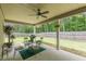 Covered back patio with a table and chairs, perfect for relaxing or entertaining while enjoying the backyard view at 446 Vandenburg Dr, Villa Rica, GA 30180