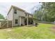 Spacious backyard featuring a well-maintained lawn and covered patio, perfect for outdoor entertaining at 446 Vandenburg Dr, Villa Rica, GA 30180