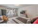 Relaxing bedroom with soft carpet, comfortable seating, and a large window for natural light at 446 Vandenburg Dr, Villa Rica, GA 30180