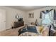 Relaxing bedroom with television and dresser, with view of large window at 446 Vandenburg Dr, Villa Rica, GA 30180