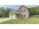 Side angle of a beautiful home showcasing a two-car garage, and well-maintained lawn at 446 Vandenburg Dr, Villa Rica, GA 30180
