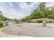 A gated entrance to a community with manicured landscaping and a secure, welcoming feel at 446 Vandenburg Dr, Villa Rica, GA 30180
