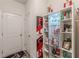 Hallway showcasing a display case with sports memorabilia and a door leading to the garage at 446 Vandenburg Dr, Villa Rica, GA 30180